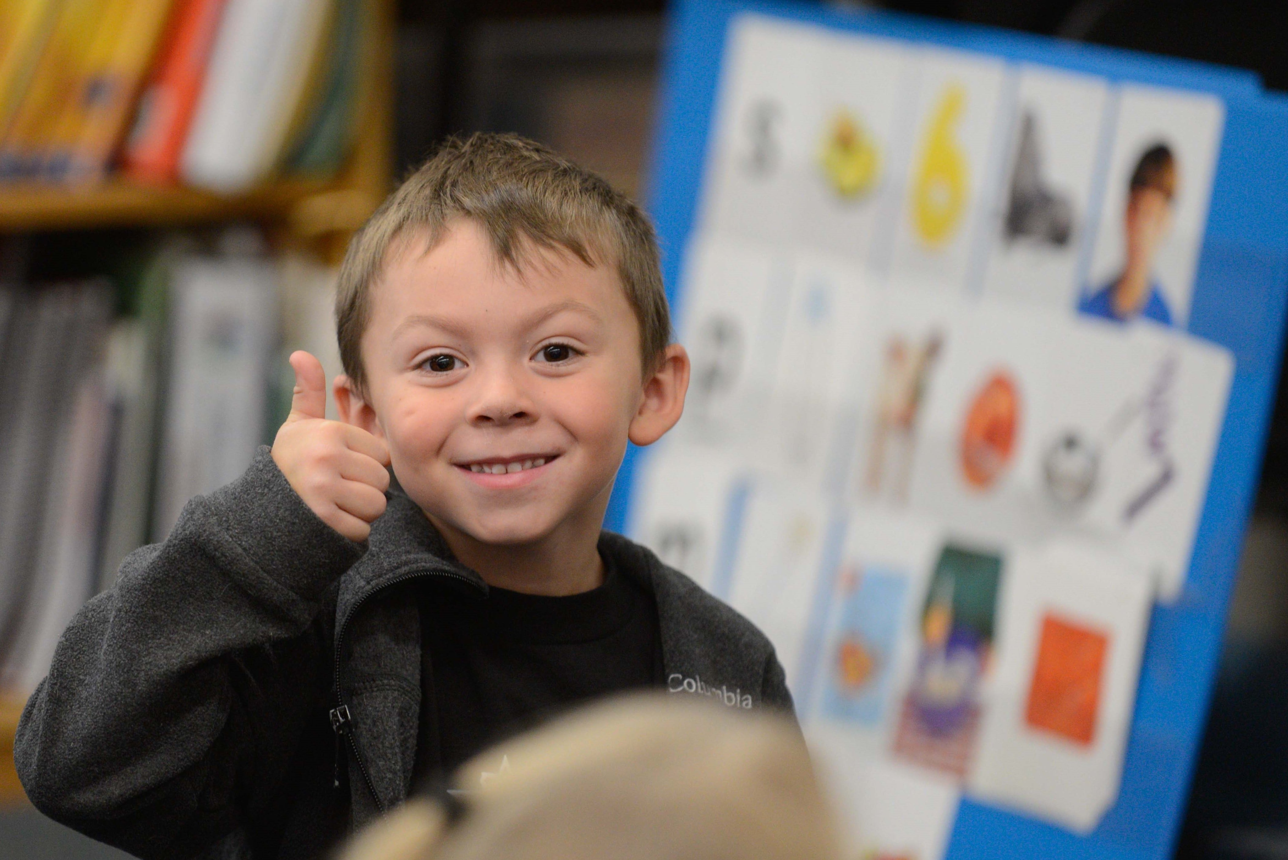 Close up of student giving a thumbs up