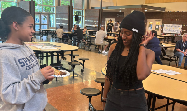 Two girls talking to each other