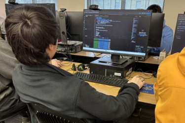 Student working on computer code