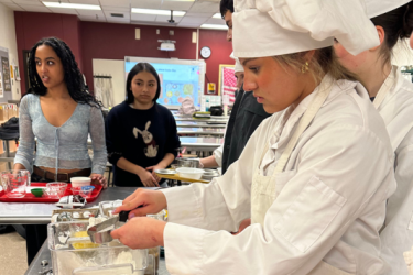 Students measuring cooking ingredients