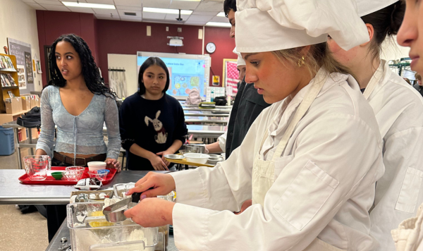 Students measuring cooking ingredients
