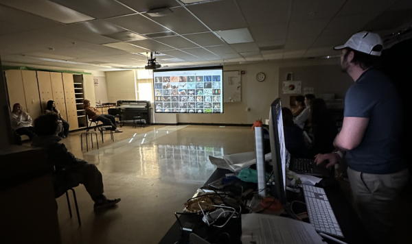 Teacher showing students photos