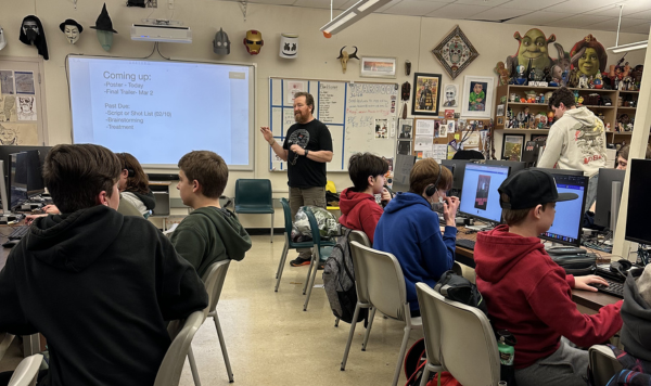 Teacher in front of a filmmaking class