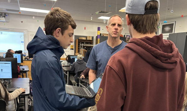 Teacher talking with students