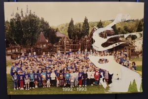 Students and staff in front of a playground