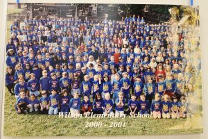 Students and staff in a field