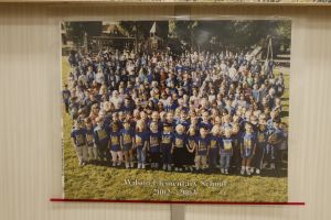 Students and staff in front of a playground