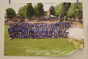 Students and staff in front of a playground