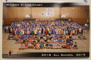 Students and staff in a school gym