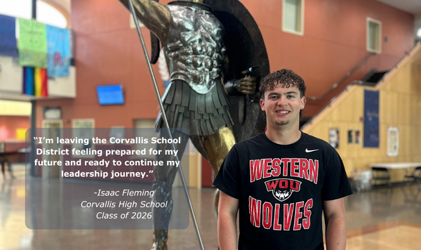 Student in front of a statue