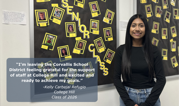 Student in front of a bulletin board