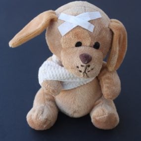 Close up of injured stuffed animal